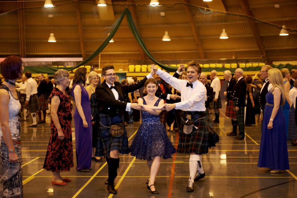 Scottish country dancers at a ball